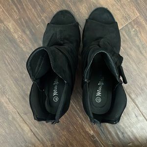 Black heeled open toe booties